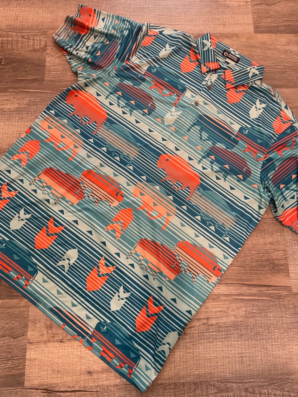 Raised by Coyotes Polo with Orange Buffalo Print